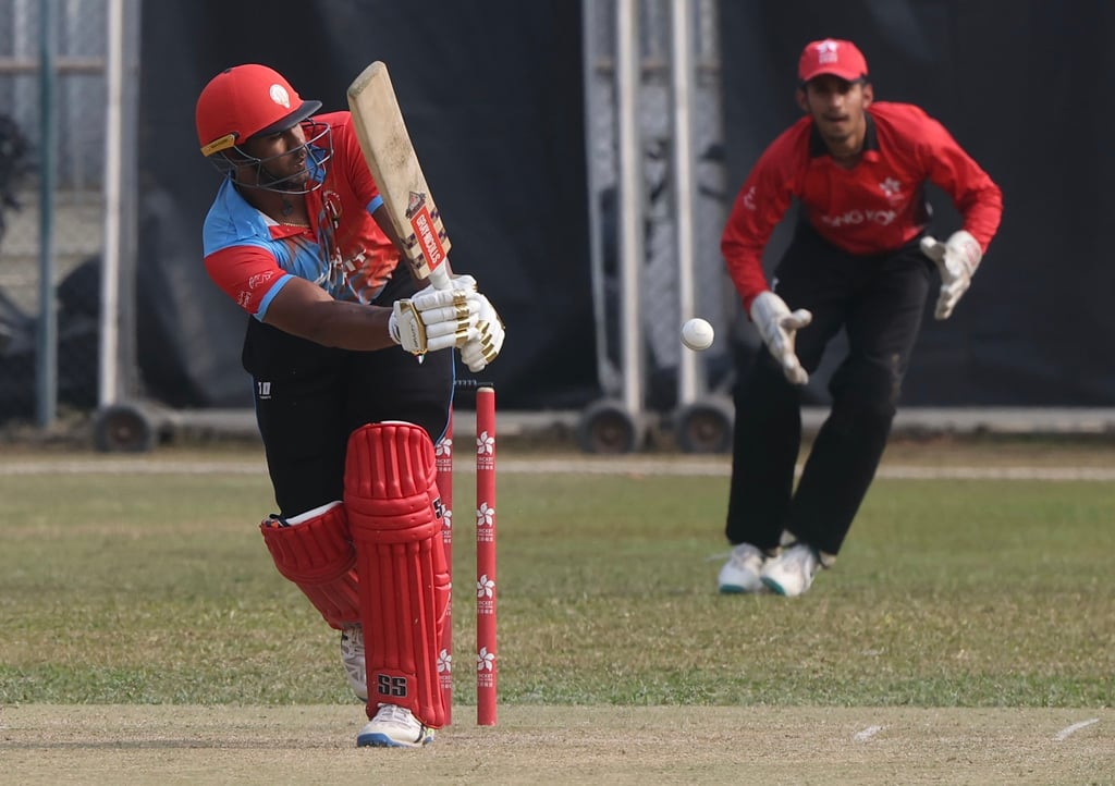 Ravija Sandaruwan hits to the leg side as Hong Kong wicketkeeper Adit Gorawara looks on. Photo: Jonathan Wong