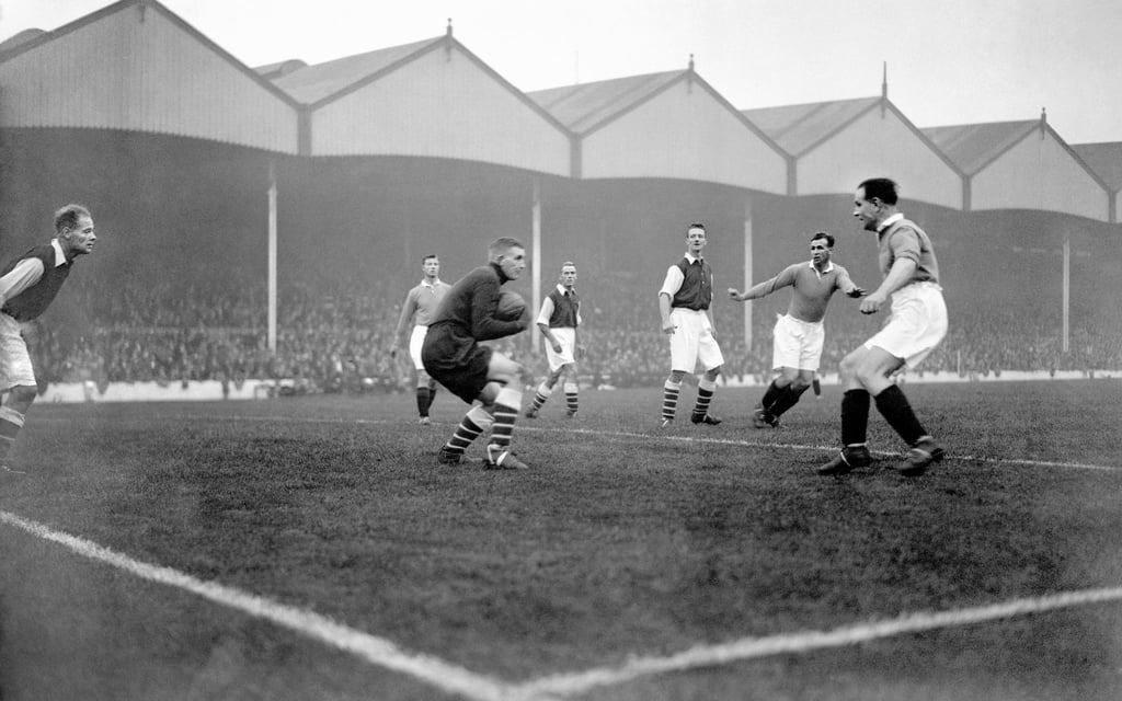 Arsenal goalkeeper Frank Moss (centre) clutches the ball to his chest in a match in 1933. The North London club dates back to 1886. Photo: Getty Images Arsenal goalkeeper Frank Moss (centre) clutches the ball to his chest in a match in 1933. The North London club dates back to 1886. Photo: Getty Images