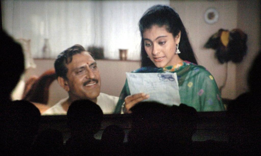 People watch the popular Hindi film Dilwale Dulhania Le Jayenge, directed by Aditya Chopra and produced by his father Yash Chopra, at a cinema in Mumbai. File photo: AFP People watch the popular Hindi film Dilwale Dulhania Le Jayenge, directed by Aditya Chopra and produced by his father Yash Chopra, at a cinema in Mumbai. File photo: AFP