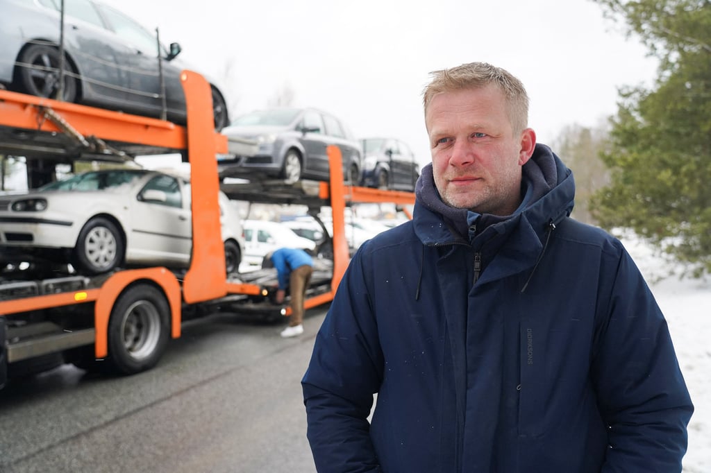 Reinis Poznaks, founder of the NGO known as Twitter Convoy stands in front of a trailer loaded with vehicles confiscated from drunk drivers in Riga, Latvia on Wednesday. Photo: Reuters Reinis Poznaks, founder of the NGO known as Twitter Convoy stands in front of a trailer loaded with vehicles confiscated from drunk drivers in Riga, Latvia on Wednesday. Photo: Reuters