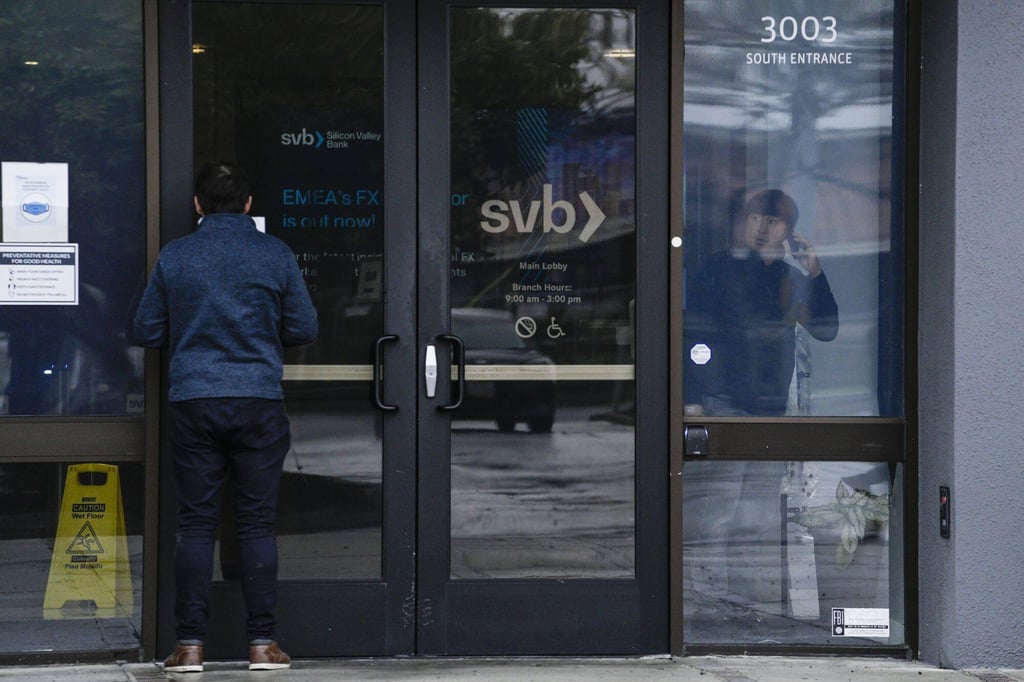A customer reads a press release at the entrance of the Silicon Valley Bank headquarters in Santa Clara, California, on March 10, 2023. The US lender became the country’s biggest bank failure in more than a decade, after its long-established customer base of tech start-ups grew worried and yanked deposits. Photo: Bloomberg A customer reads a press release at the entrance of the Silicon Valley Bank headquarters in Santa Clara, California, on March 10, 2023. The US lender became the country’s biggest bank failure in more than a decade, after its long-established customer base of tech start-ups grew worried and yanked deposits. Photo: Bloomberg