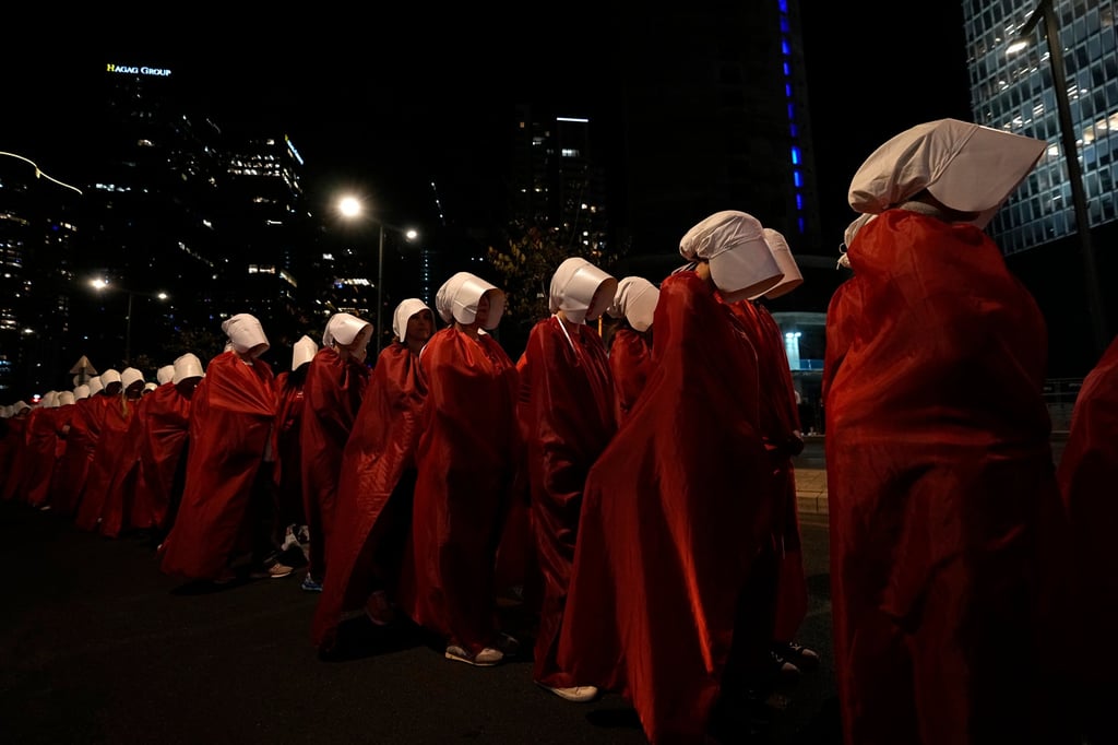 Israeli women’s rights activists dressed as characters in the popular television series “The Handmaid’s Tale” protest against plans by Prime Minister Benjamin Netanyahu’s government to overhaul the judicial system, in Tel Aviv on Saturday. Photo: AP