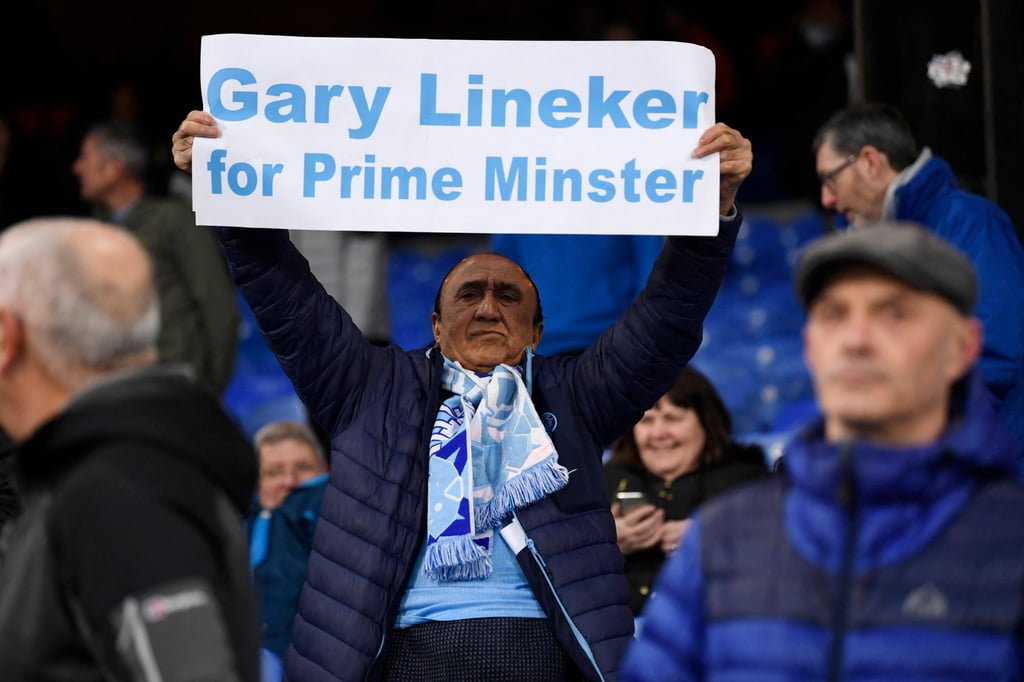 A Manchester City fan at Selhurst Park stadium in London holds a sign in support of BBC presenter Gary Lineker before the match against Crystal Palace on Saturday. Photo: Reuters