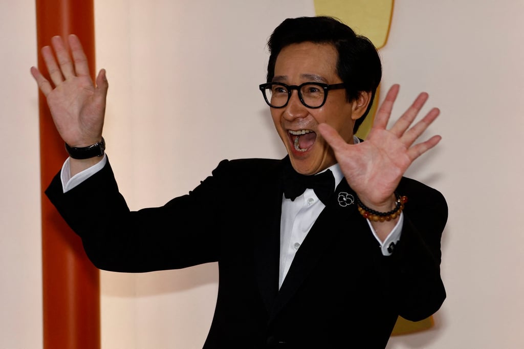 Wearing an Armani tuxedo, Ke Huy Quan, best supporting actor nominee for his role in “Everything Everywhere All at Once”, gestures as he arrives for the Oscars ceremony. Photo: Reuters