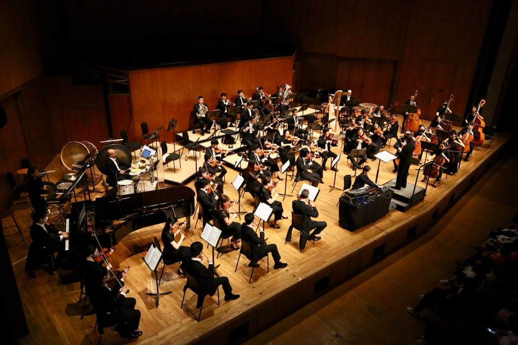 Hong Kong composer Lam Lai (front, centre) performing as electronics soloist with the Hong Kong Sinfonietta during the world premiere of her work “There is No Place like Home (Beta)“ at the Hong Kong City Hall Concert Hall. Photo: HK Sinfonietta