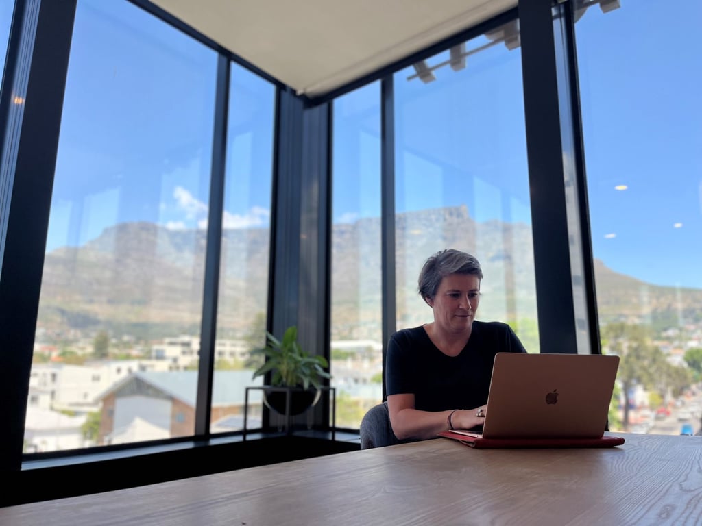 Christina Leitner working on her laptop in an office in Cape Town, South Africa. She has been a digital nomad for 11 years. Photo: Getty Images