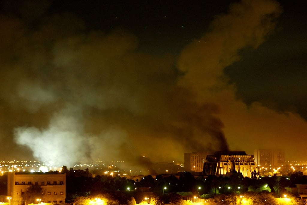 Smoke billows from a presidential palace compound in Baghdad on March 21, 2003. File photo: Reuters