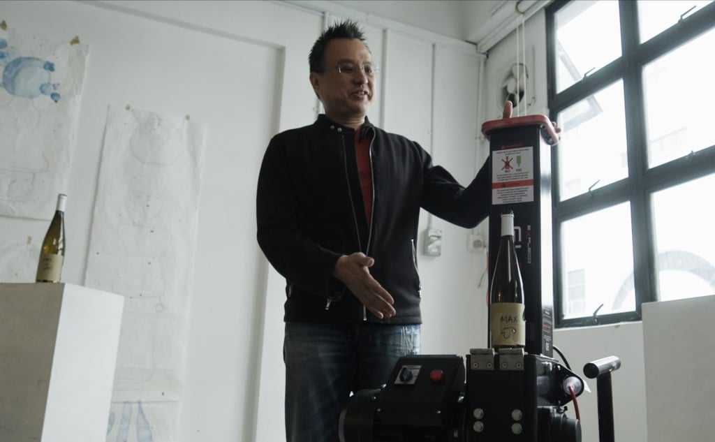 Terra Sol CEO Joe Tan demonstrates the glass crusher, which turns used glass products such as wine bottles into small particles that can potentially be repurposed in glazes for ceramics. Terra Sol CEO Joe Tan demonstrates the glass crusher, which turns used glass products such as wine bottles into small particles that can potentially be repurposed in glazes for ceramics.