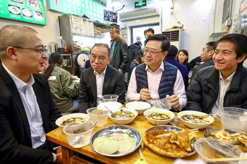 Chief Executive John Lee Ka-chiu enjoys breakfast with colleagues. Photo: Facebook/@John KC Lee