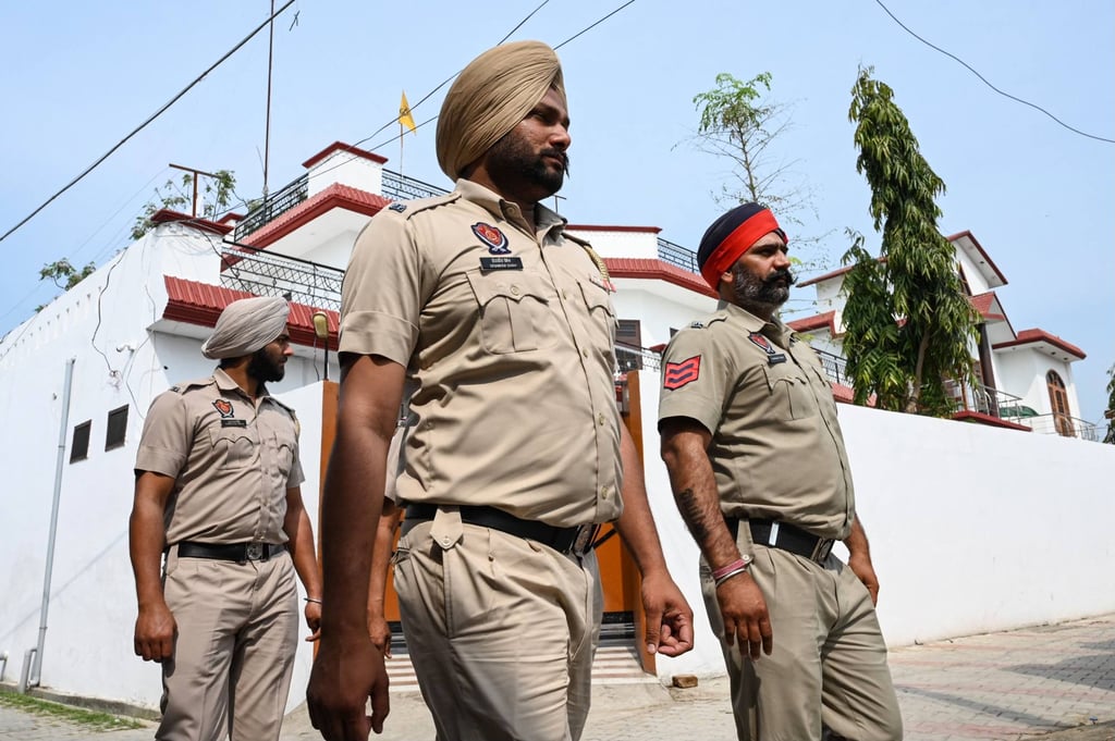 Punjab police near the residence of Waris Punjab De’ chief Amritpal Singh, in the village Jallupur Khera, near Amritsar on Sunday. Photo: AFP