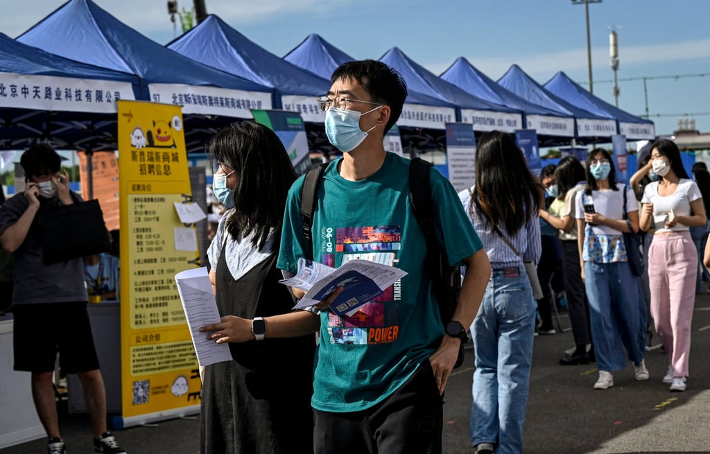 People attend a job fair in Beijing in August. About one in five young people are unemployed in China. Photo: AFP