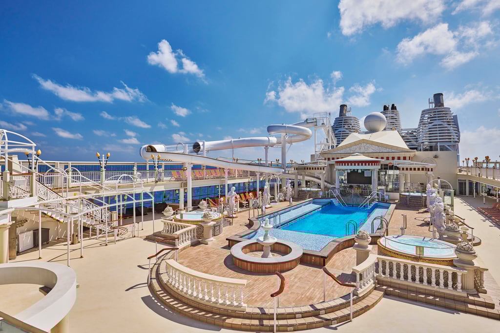 The Roman-themed Parthenon pool deck hosts live bands. Photo: Resorts World Cruises The Roman-themed Parthenon pool deck hosts live bands. Photo: Resorts World Cruises