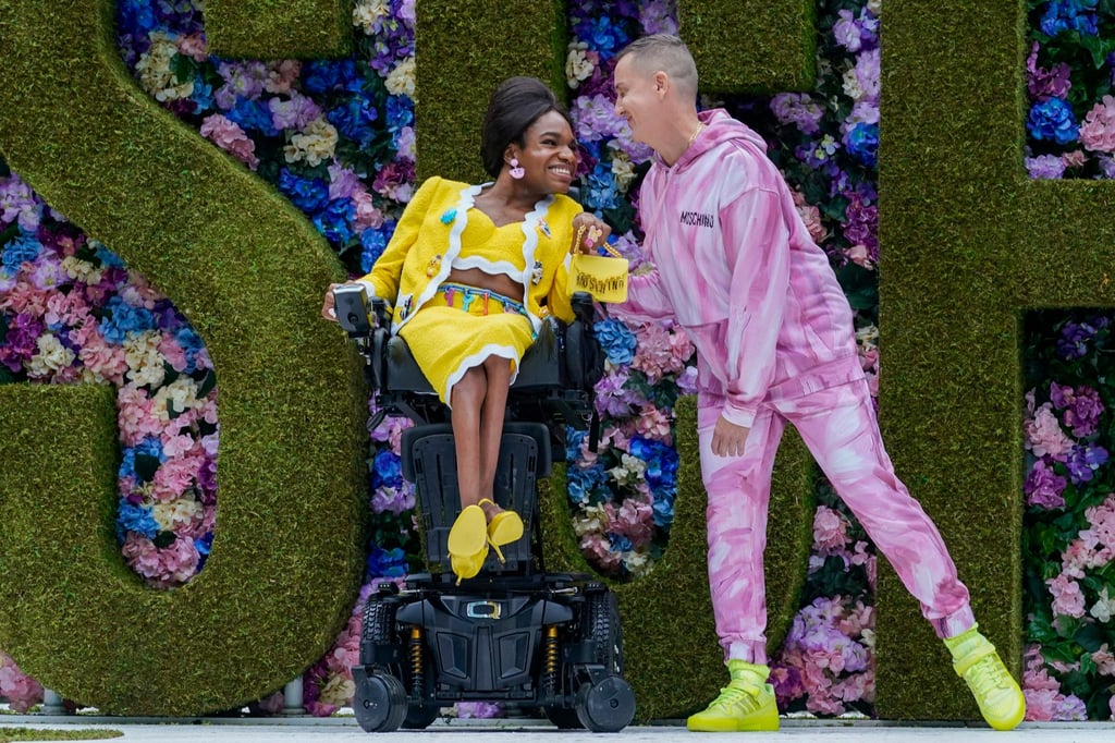 Moschino fashion house creative director Jeremy Scott, right, appears on the runway with a model after the collection was presented during New York Fashion Week in September 2021. Photo: AP Photo Moschino fashion house creative director Jeremy Scott, right, appears on the runway with a model after the collection was presented during New York Fashion Week in September 2021. Photo: AP Photo