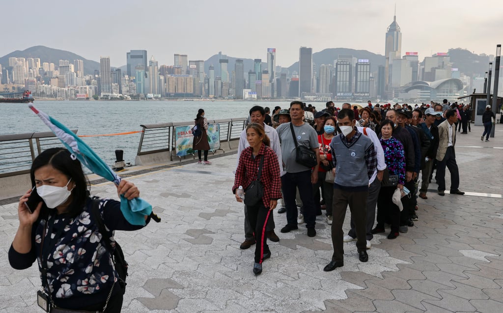 A troupe of tourists from mainland China at the Avenue of the Stars promenade at the Tsim Sha Tsui waterfront on 15 March 2023. Photo: May Tse A troupe of tourists from mainland China at the Avenue of the Stars promenade at the Tsim Sha Tsui waterfront on 15 March 2023. Photo: May Tse
