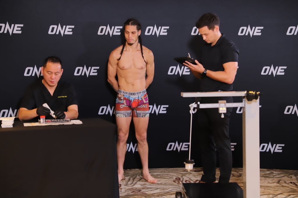 Eddie Abasalo’s hydration sample is tested by Dr Warren Wang at the ONE Fight Night 8 weigh-ins. Photo: Nicolas Atkin Eddie Abasalo’s hydration sample is tested by Dr Warren Wang at the ONE Fight Night 8 weigh-ins. Photo: Nicolas Atkin