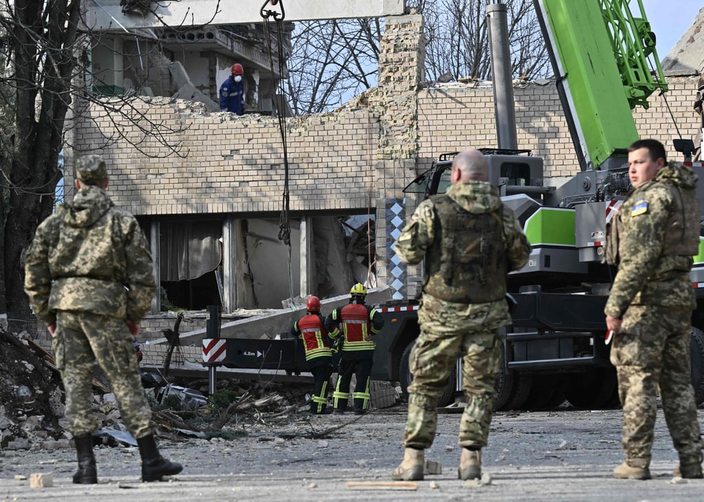 Rescuers clear debris at a partially destroyed building after an air strike in the town of Rzhyshchiv, in the Kyiv region on March 22 amid the Russian invasion of Ukraine. Photo: AFP Rescuers clear debris at a partially destroyed building after an air strike in the town of Rzhyshchiv, in the Kyiv region on March 22 amid the Russian invasion of Ukraine. Photo: AFP