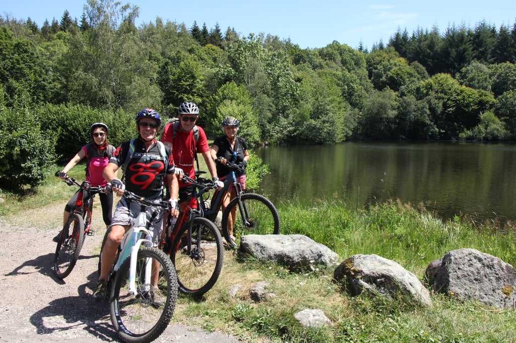 Bike tourists arriving for a waterside lunch at the secluded lake of the Auberge des Mille Etangs. Photo: John Brunton