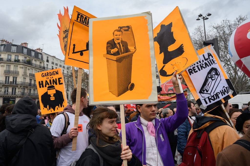 Demonstrators hold up a sign bearing the effigy of President Macron during a demonstration against pension reforms on Friday. Photo: Le Pictorium via Zuma Press/dpa Demonstrators hold up a sign bearing the effigy of President Macron during a demonstration against pension reforms on Friday. Photo: Le Pictorium via Zuma Press/dpa
