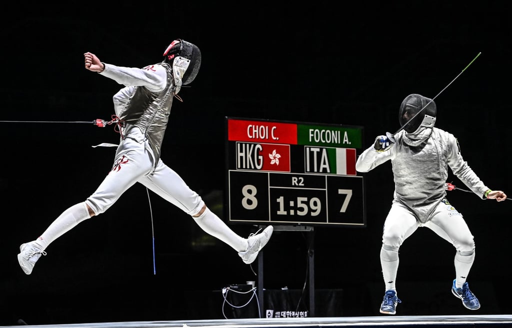 Fencer Ryan Choi Chun-yin (left) leaps into the air against Alessio Foconi. Photo: FIE