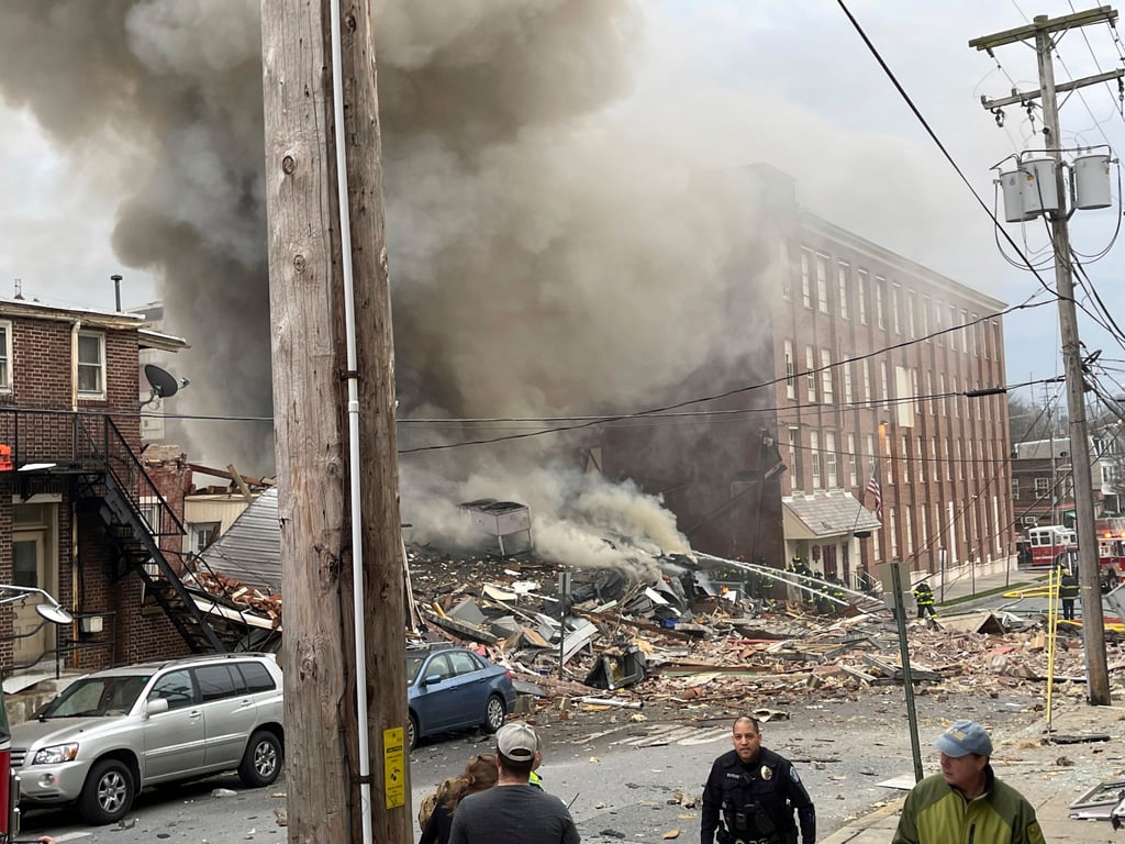 Emergency workers at the site of a deadly explosion at a chocolate factory in West Reading, Pennsylvania on Friday. Photo: Reading Eagle via AP