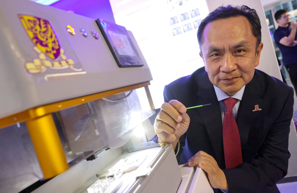 Liu Yunhui with an automatic robotic system for transferring and vitrifying embryos in assisted reproduction. Photo: May Tse Liu Yunhui with an automatic robotic system for transferring and vitrifying embryos in assisted reproduction. Photo: May Tse