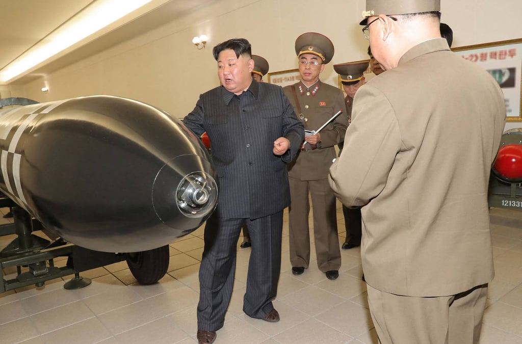 Kim Jong-un is seen in the images released by state media showing him with military officials among his arsenal of warheads. Photo: KCNA via KNS/AFP Kim Jong-un is seen in the images released by state media showing him with military officials among his arsenal of warheads. Photo: KCNA via KNS/AFP