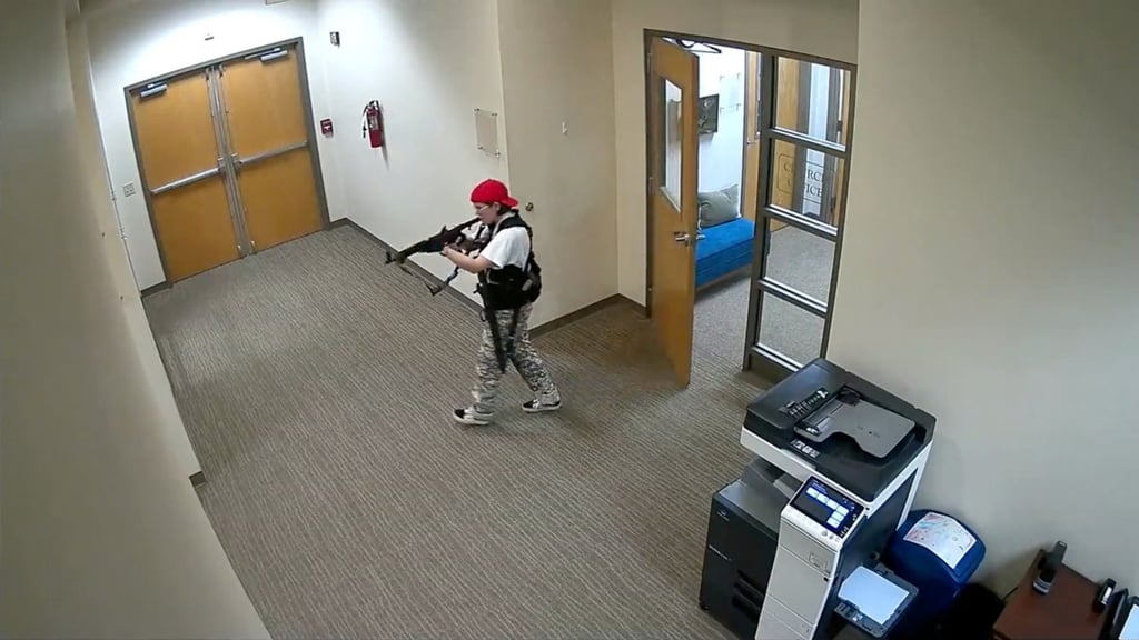 A still image from surveillance video shows what police say is mass shooting suspect Audrey Elizabeth Hale, 28, walking in The Covenant School carrying weapons on Monday. Photo: Metropolitan Nashville Police Department via Reuters