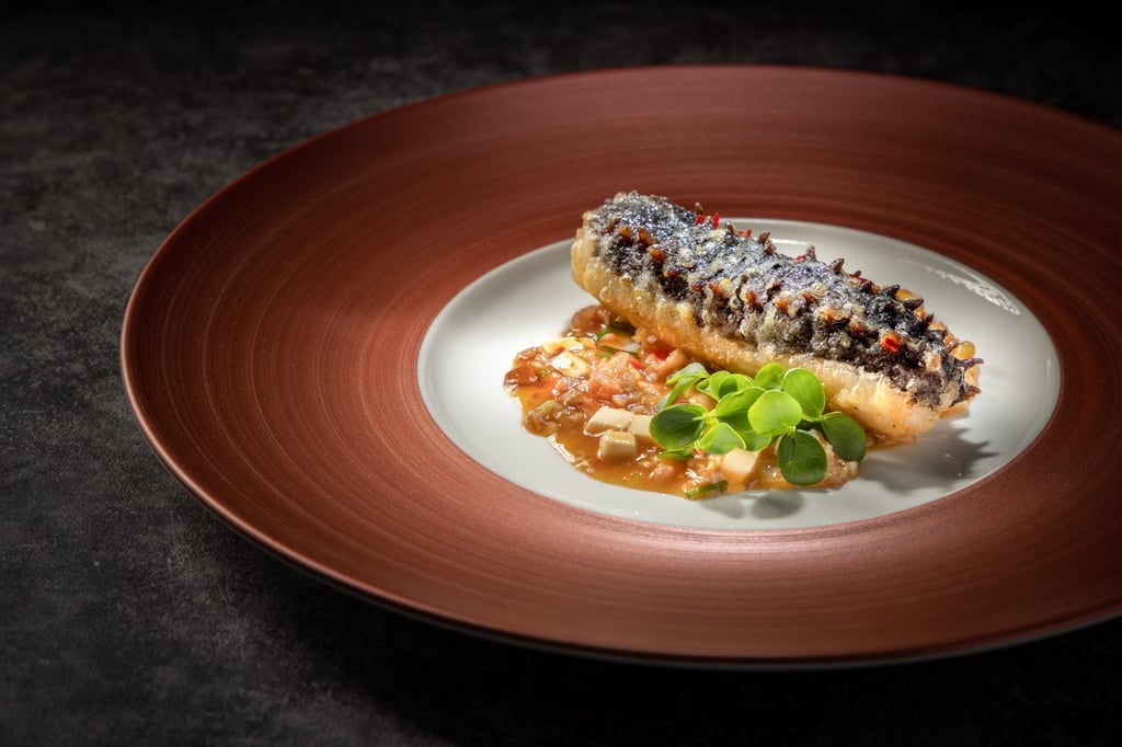 Crispy sea cucumber stuffed with tofu fish mousse, served with ma po minced pork sauce at Hong Kong Cuisine 1983. Photo: Handout