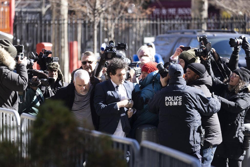 FTX founder Sam Bankman-Fried (centre) arrives at court in New York on Thursday. Photo: Bloomberg FTX founder Sam Bankman-Fried (centre) arrives at court in New York on Thursday. Photo: Bloomberg