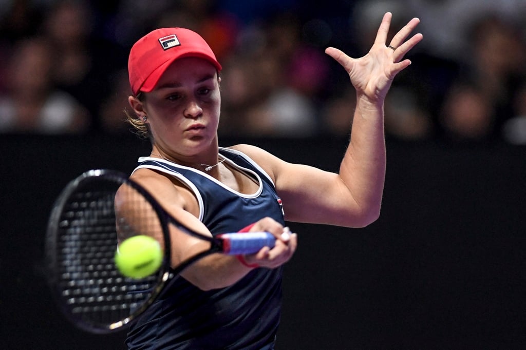 Ashleigh Barty hits a return against Elina Svitolina during their women’s singles in the WTA Finals tournament in Shenzhen on November 3, 2019. Photo: AFP