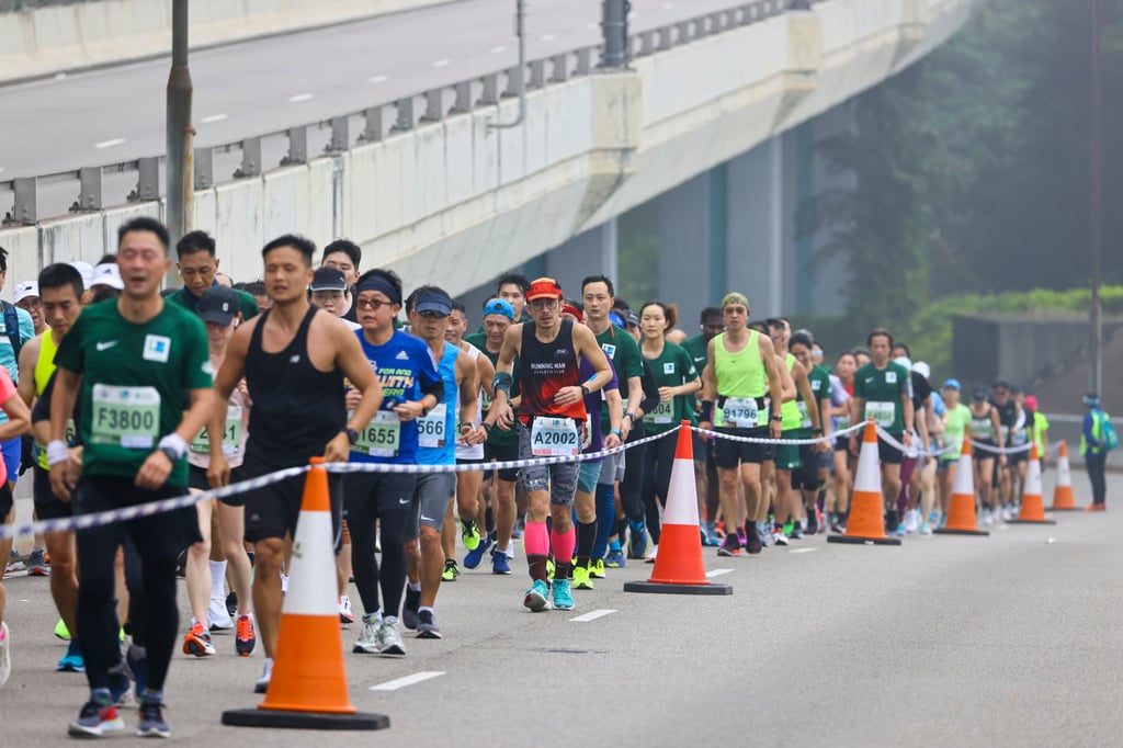 Runners move through Sai Ying Pun during the 25th Standard Chartered Hong Kong Marathon earlier this year. Photo: Dickson Lee Runners move through Sai Ying Pun during the 25th Standard Chartered Hong Kong Marathon earlier this year. Photo: Dickson Lee