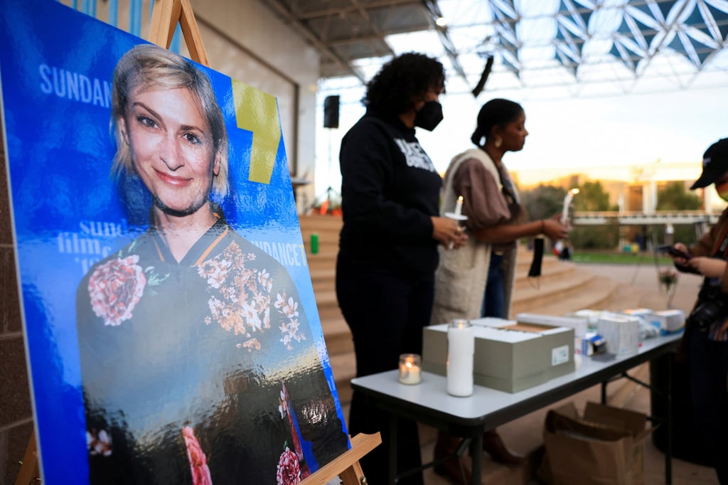 An image of cinematographer Halyna Hutchins, who died after being shot by Alec Baldwin on the set of Rust, is displayed at a vigil in her honour in Albuquerque, New Mexico, in October 2021. Photo: Reuters An image of cinematographer Halyna Hutchins, who died after being shot by Alec Baldwin on the set of Rust, is displayed at a vigil in her honour in Albuquerque, New Mexico, in October 2021. Photo: Reuters