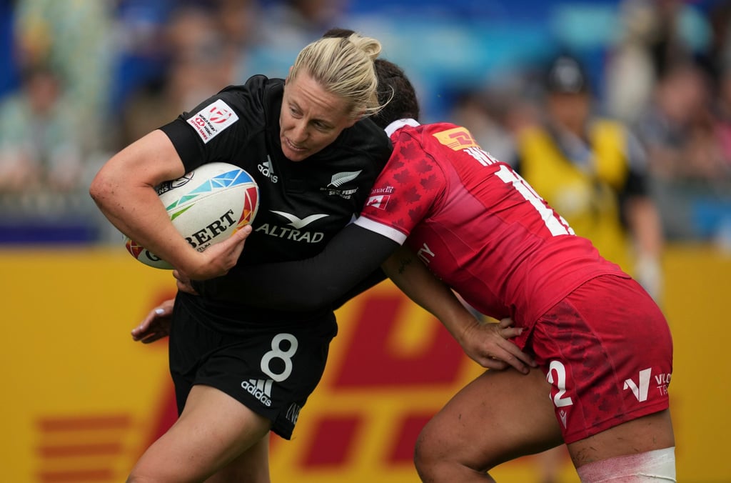New Zealand’s Kelly Brazier tries to break the tackle of Canada’s Keyara Wardley. Photo: Sam Tsang