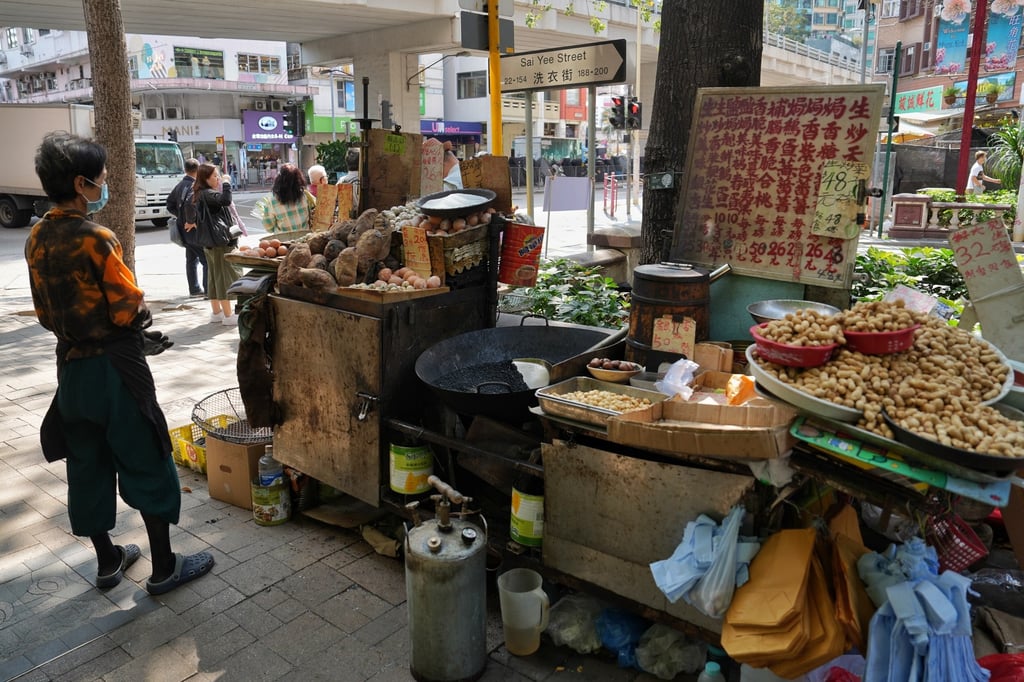 A hawker selling chestnuts and other kinds of food near the Flower Market in Mong Kok. Photo: Elson Li A hawker selling chestnuts and other kinds of food near the Flower Market in Mong Kok. Photo: Elson Li