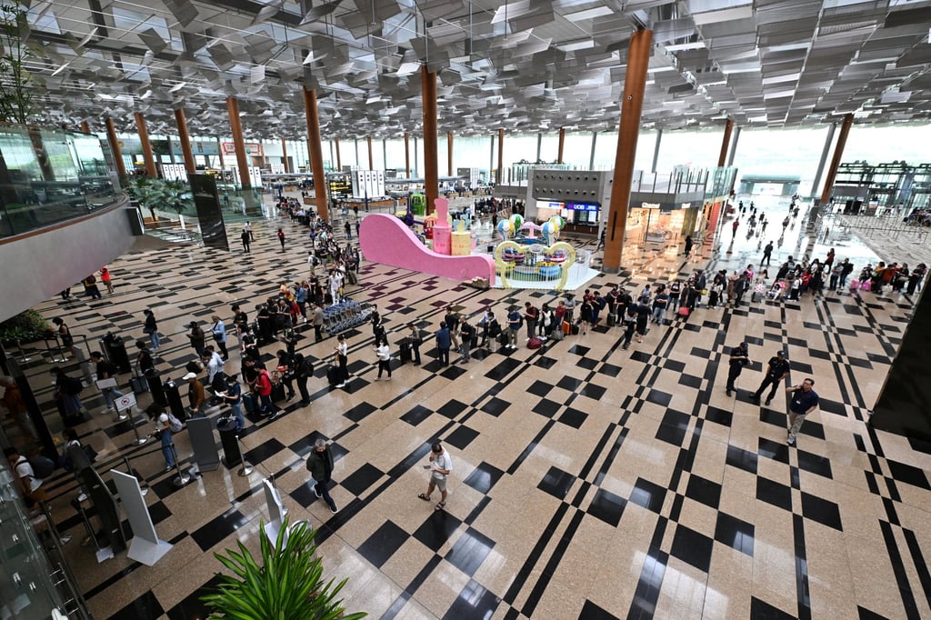Passengers queue at the departure hall of Changi Airport Terminal 3 in Singapore on March 31, 2023. The Straits Times/Lim Yaohui via Reuters Passengers queue at the departure hall of Changi Airport Terminal 3 in Singapore on March 31, 2023. The Straits Times/Lim Yaohui via Reuters