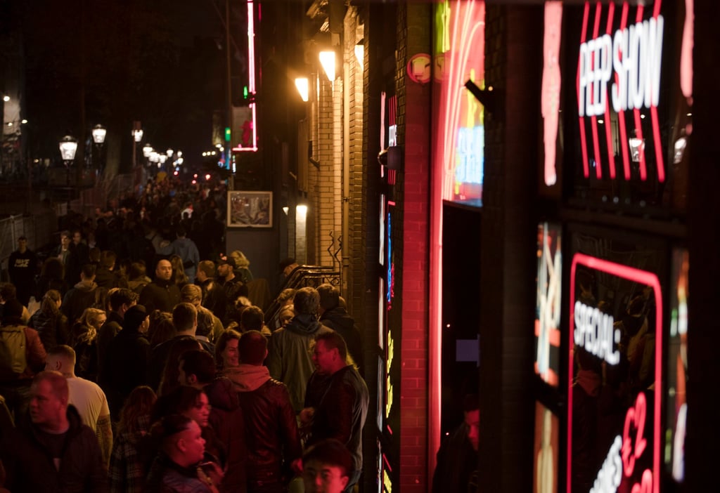 Tourists shuffle through the narrow alleys in Amsterdam’s red light district, Netherlands. Photo: AP