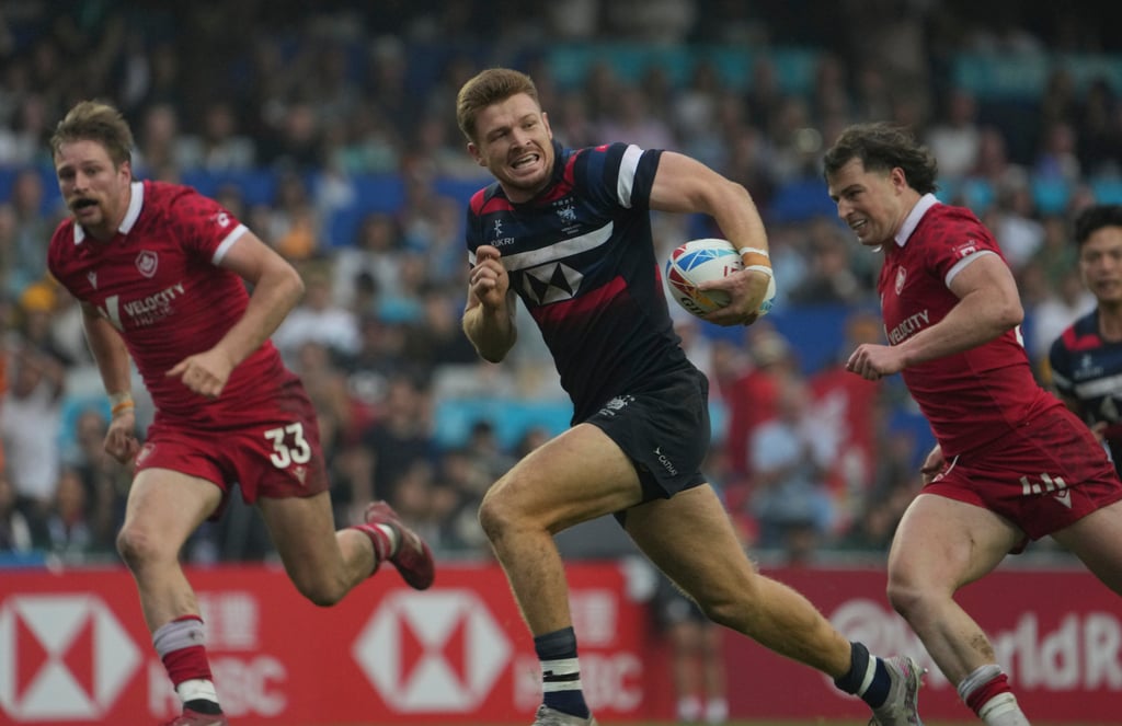 Hong Kong’s Liam Herbert runs in the second try in the Shield final. Photo: Elson Li