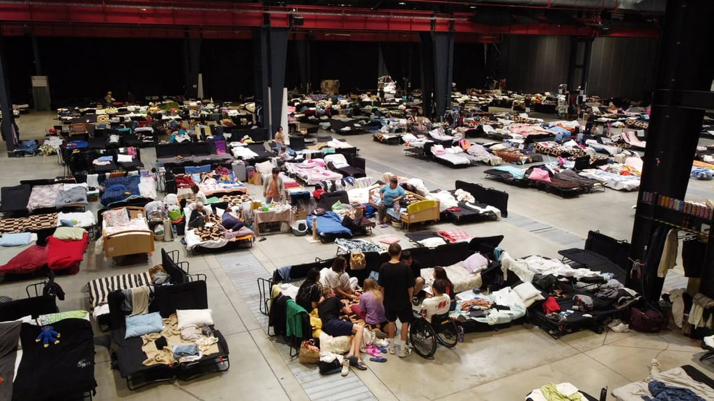 Ukrainian refugees at the Humanitarian Aid Centre set up at the Global Expo exhibition hall in Warsaw on July 15, 2022. Photo: AFP Ukrainian refugees at the Humanitarian Aid Centre set up at the Global Expo exhibition hall in Warsaw on July 15, 2022. Photo: AFP