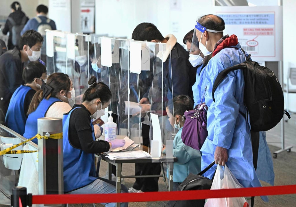 Passengers from Shanghai present proof of a negative Covid-19 test on their arrival at Narita airport near Tokyo on January 8, 2023. Photo: via AP