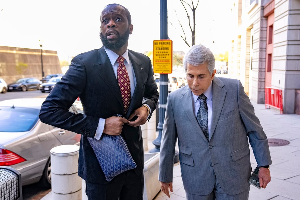 Prakazrel “Pras” Michel (left) and defence lawyer David Kenner arrive at federal court in Washington on Monday. Photo: AP Prakazrel “Pras” Michel (left) and defence lawyer David Kenner arrive at federal court in Washington on Monday. Photo: AP