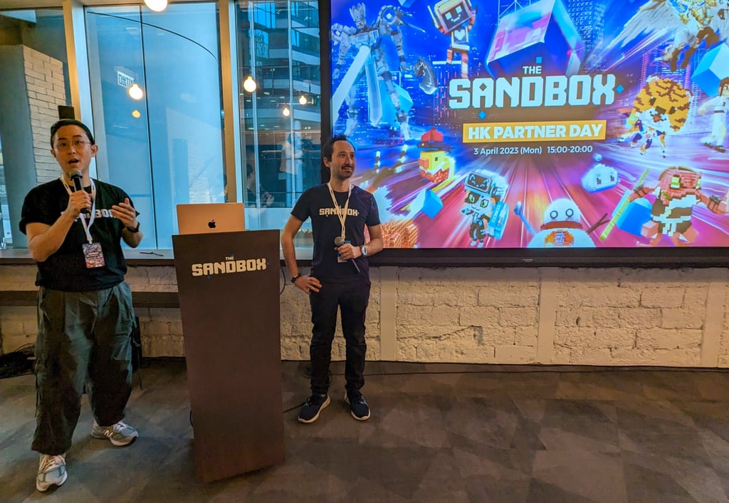 The Sandbox’s Erich Wong (left), head of growth in Greater China, and Sebastien Borget, co-founder and chief operating officer, speak at the company’s HK Partner Day held in Hong Kong’s Quarry Bay district on April 3, 2023. Photo: SCMP / Matt Haldane
