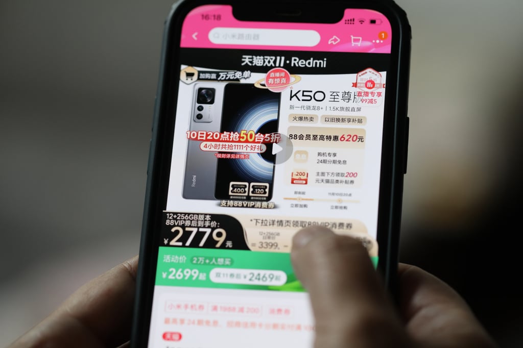 An online shopper checks the price discount of a Xiaomi smartphone in the Chinese firm’s flagship store on Alibaba Group Holding’s Taobao platform on November 10, 2022. Photo: Simon Song