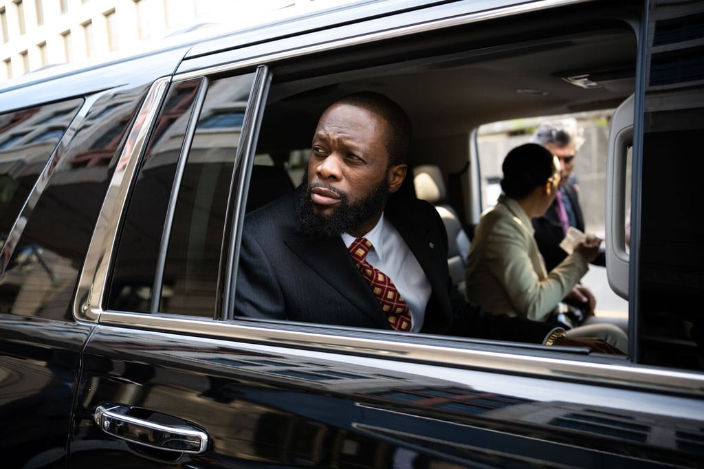 Pras Michel, former member of the Fugees, exits federal court in Washington on Monday. He is accused of illegally lobbying on Low’s behalf and acting as an unregistered agent of China. Photo: Bloomberg Pras Michel, former member of the Fugees, exits federal court in Washington on Monday. He is accused of illegally lobbying on Low’s behalf and acting as an unregistered agent of China. Photo: Bloomberg