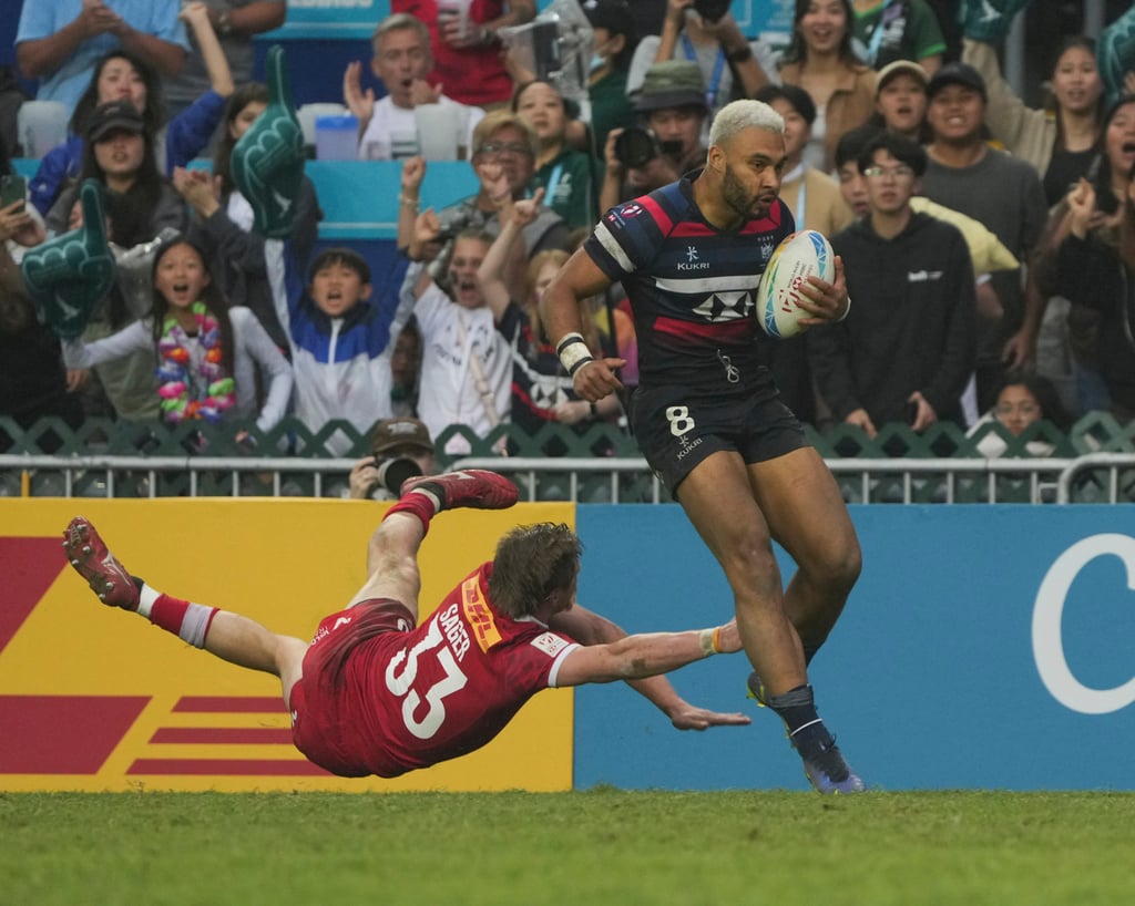 Max Denmark eludes Canada’s Kalin Sager on his way to the try-line in last Sunday’s Shield final. Photo: Elson Li Max Denmark eludes Canada’s Kalin Sager on his way to the try-line in last Sunday’s Shield final. Photo: Elson Li