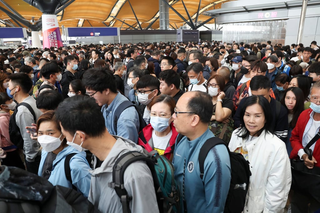 Travellers queue up for the Golden Bus, the only shuttle service on the Hong Kong-Zhuhai-Macau Bridge. Photo: Edmond So