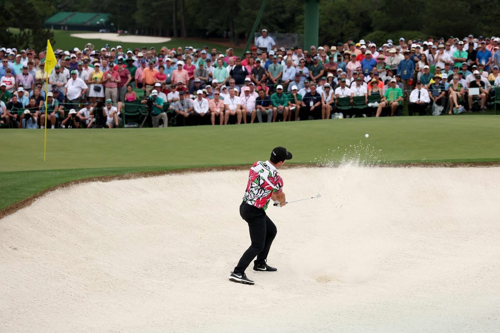 Viktor Hovland chips out of a bunker on 18 during the first round of the 2023 Masters. Photo: AFP Viktor Hovland chips out of a bunker on 18 during the first round of the 2023 Masters. Photo: AFP