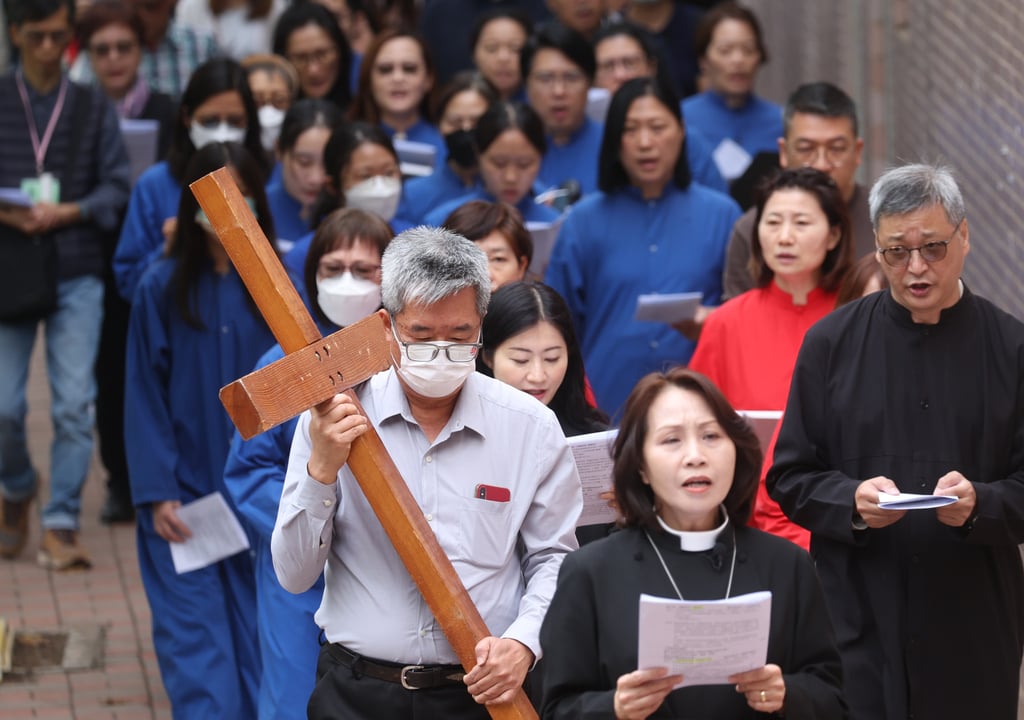 Some worshippers wear face masks while attending an Easter march on Good Friday at Tin Shui Wai. Photo: Yik Yeung-man Some worshippers wear face masks while attending an Easter march on Good Friday at Tin Shui Wai. Photo: Yik Yeung-man