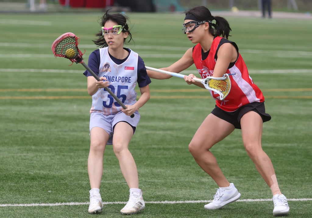 Singapore club Crossfire’s Grace Ho Yun-yan (left) in action against Hong Kong. Photo: Yik Yeung-man