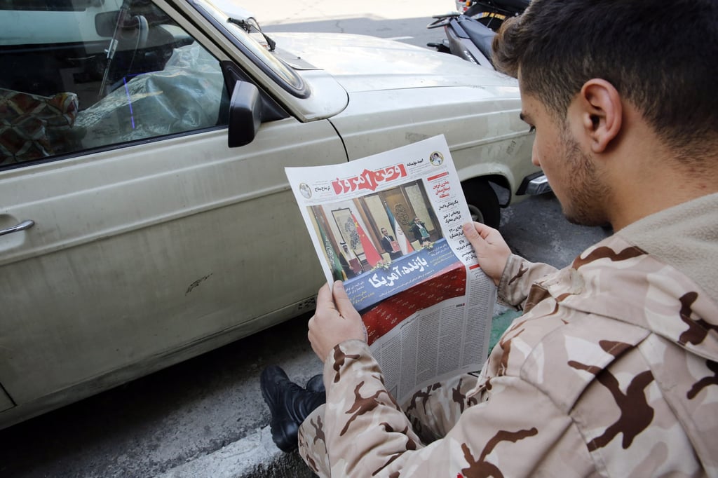A man in Tehran, Iran reads a copy of Iranian daily newspaper Vatan Emrouz on March 11 reporting on the tripartite agreement between China, Iran and Saudi Arabia signed in Beijing the previous day. Photo: EPA-EFE A man in Tehran, Iran reads a copy of Iranian daily newspaper Vatan Emrouz on March 11 reporting on the tripartite agreement between China, Iran and Saudi Arabia signed in Beijing the previous day. Photo: EPA-EFE