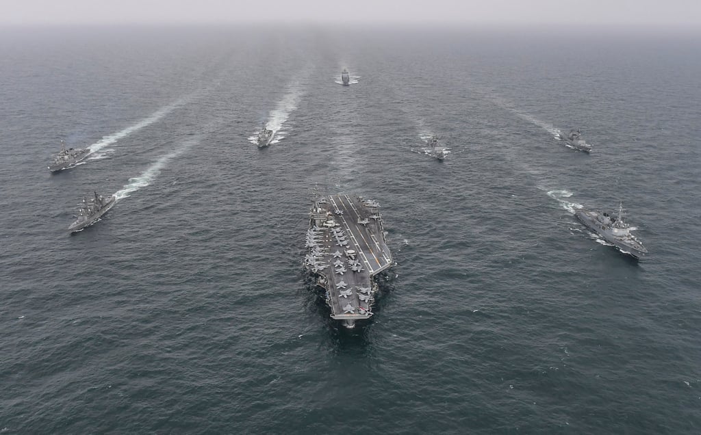 Vessels from the navies of Japan, South Korea and the US, including the USS Nimitz aircraft carrier (centre), sail in formation during a joint naval exercise last week. Photo: South Korea Defence Ministry via AP Vessels from the navies of Japan, South Korea and the US, including the USS Nimitz aircraft carrier (centre), sail in formation during a joint naval exercise last week. Photo: South Korea Defence Ministry via AP